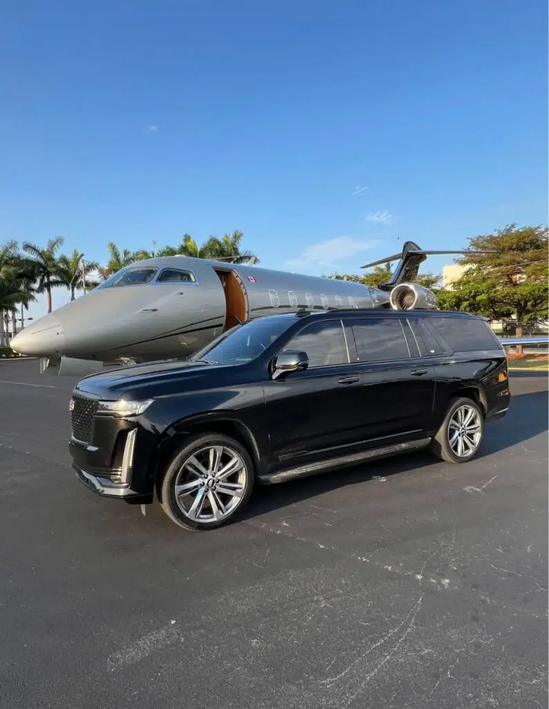 Luxury black SUV beside a private jet for private jet ground transfers Vancouver.